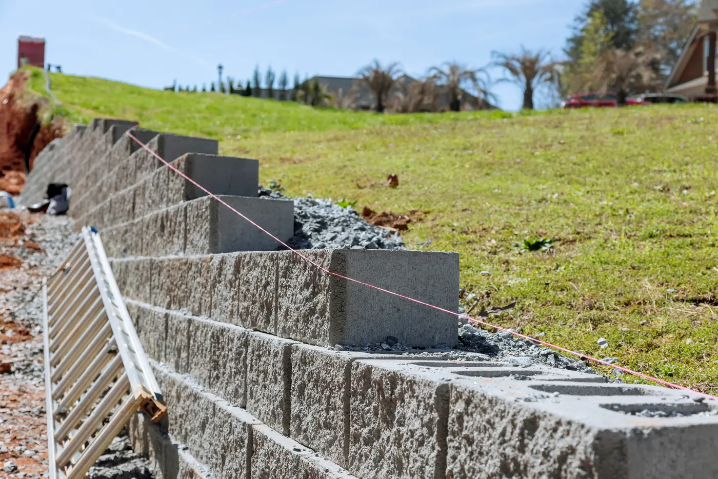 Segmental block retaining wall under construction with a string line in Elizabeth, near Parker, CO