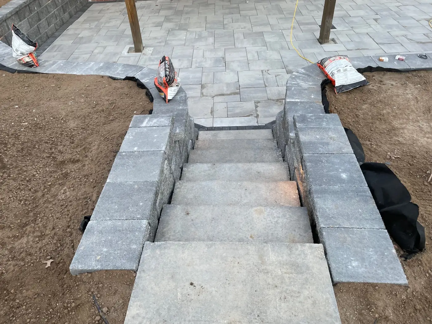 Paver steps under construction Concrete block and paver steps being set over fabric and base rock during construction in Parker, CO