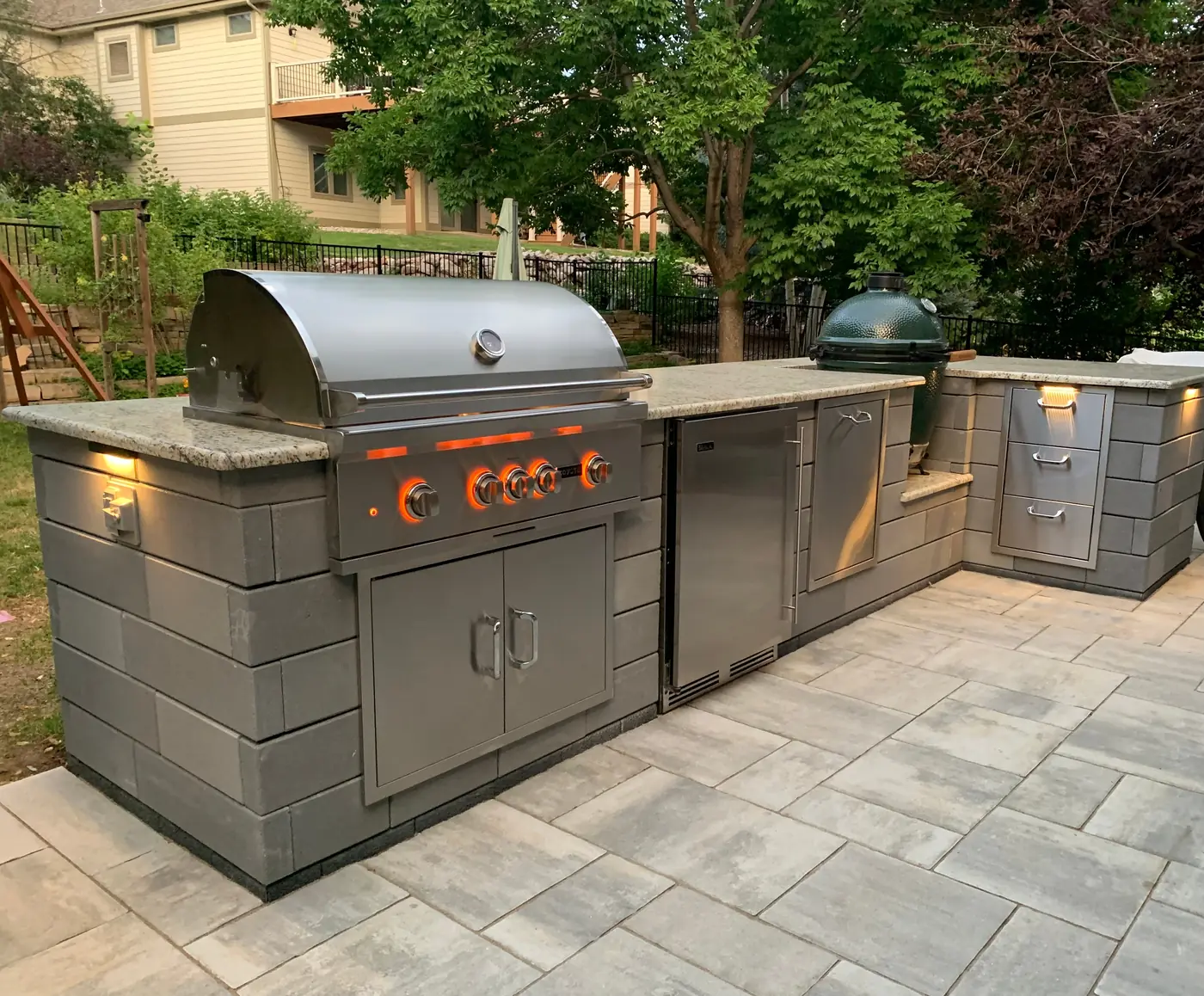 Modular outdoor kitchen Modular outdoor kitchen with gray cabinets, grill and side burner on a paver patio in Castle Pines, near Parker, CO