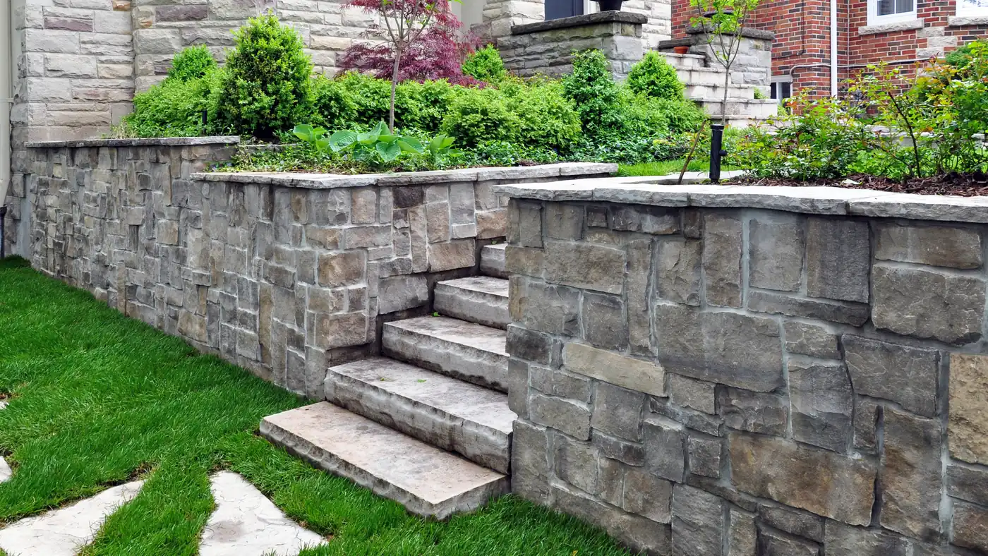 Stone wall, steps and planters Stone retaining wall with steps and planter beds around a Japanese maple in Castle Rock, near Parker, CO