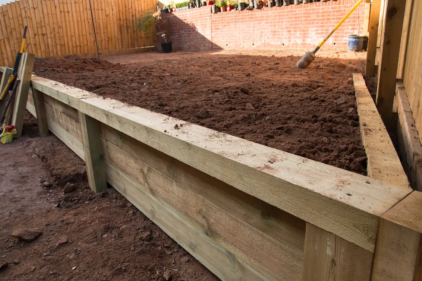 Timber retaining wall bed Timber retaining wall garden bed filled with fresh soil in Elizabeth, near Parker, CO