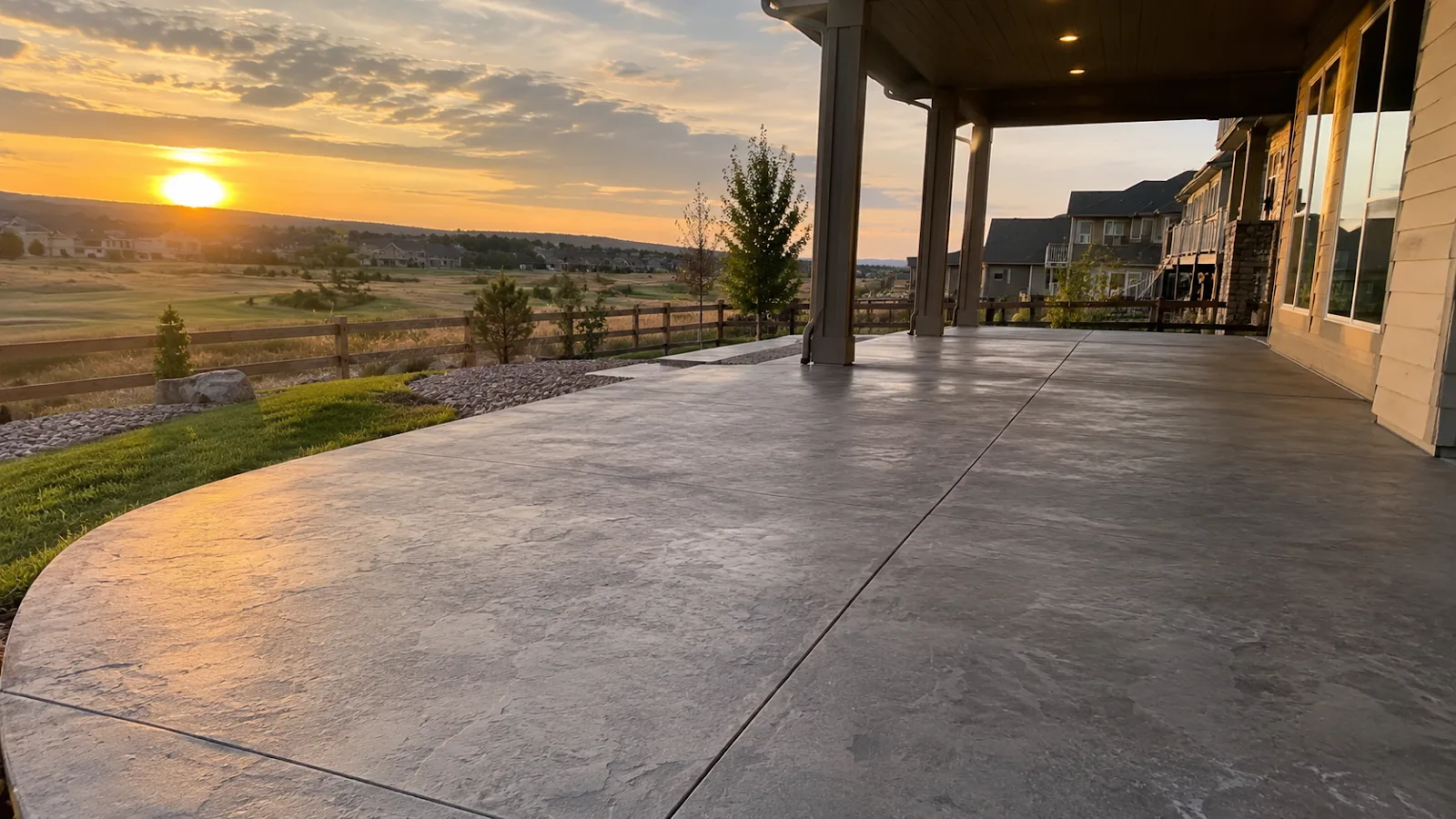 Stamped concrete backyard patio under a covered porch in Parker, CO