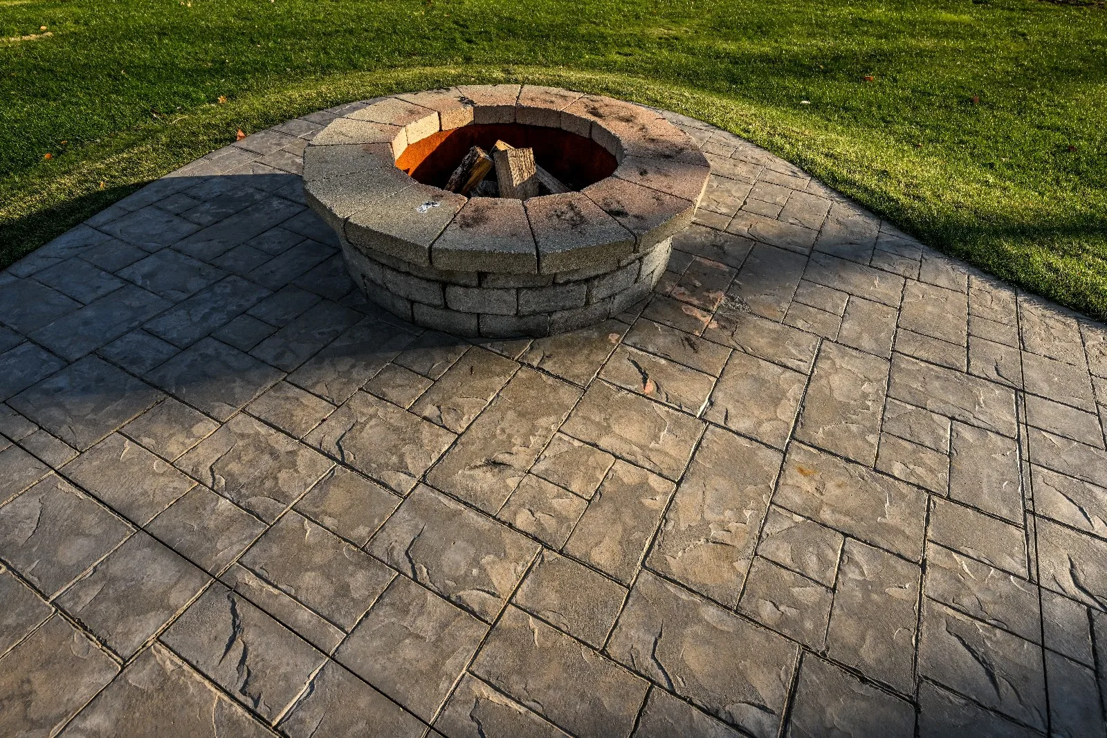 Restored stamped concrete patio with a fire pit in Parker, CO