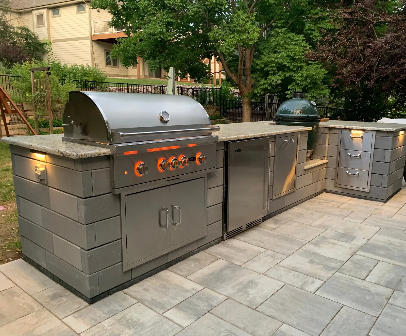 Grill island with smoker Stone grill island with a built-in smoker and prep counter on a backyard patio in Parker, CO